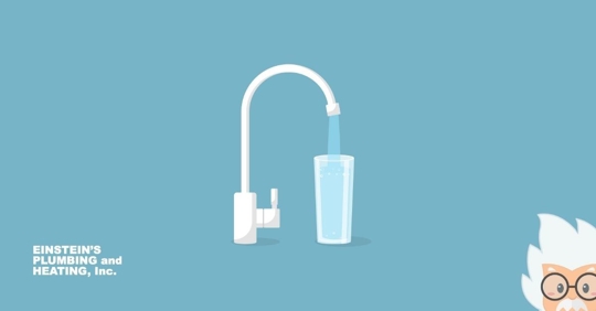 A glass being filled with tap water.